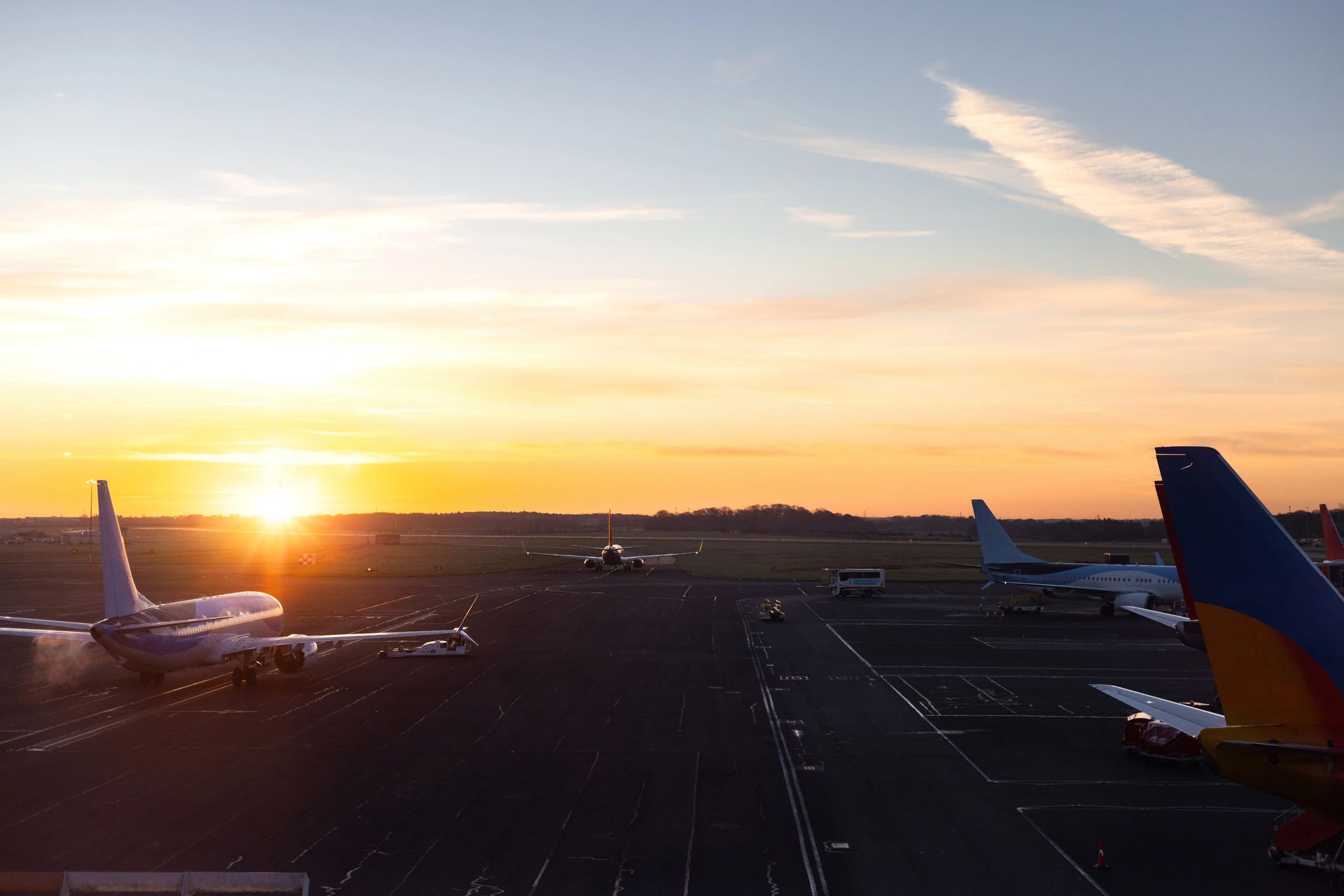 Aircraft on runway at sunrise representing urgent logistics