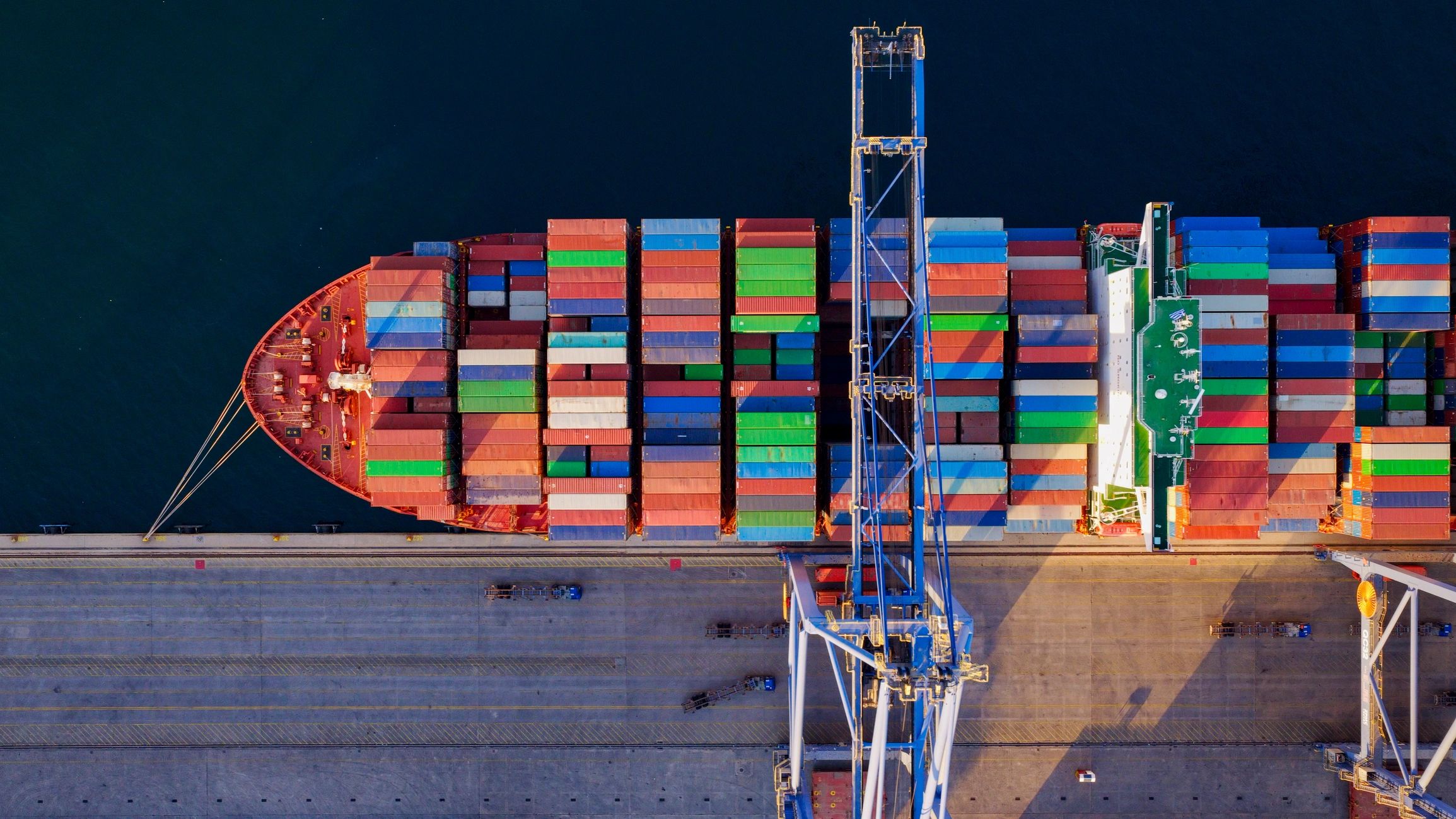 Container ship at port with cranes